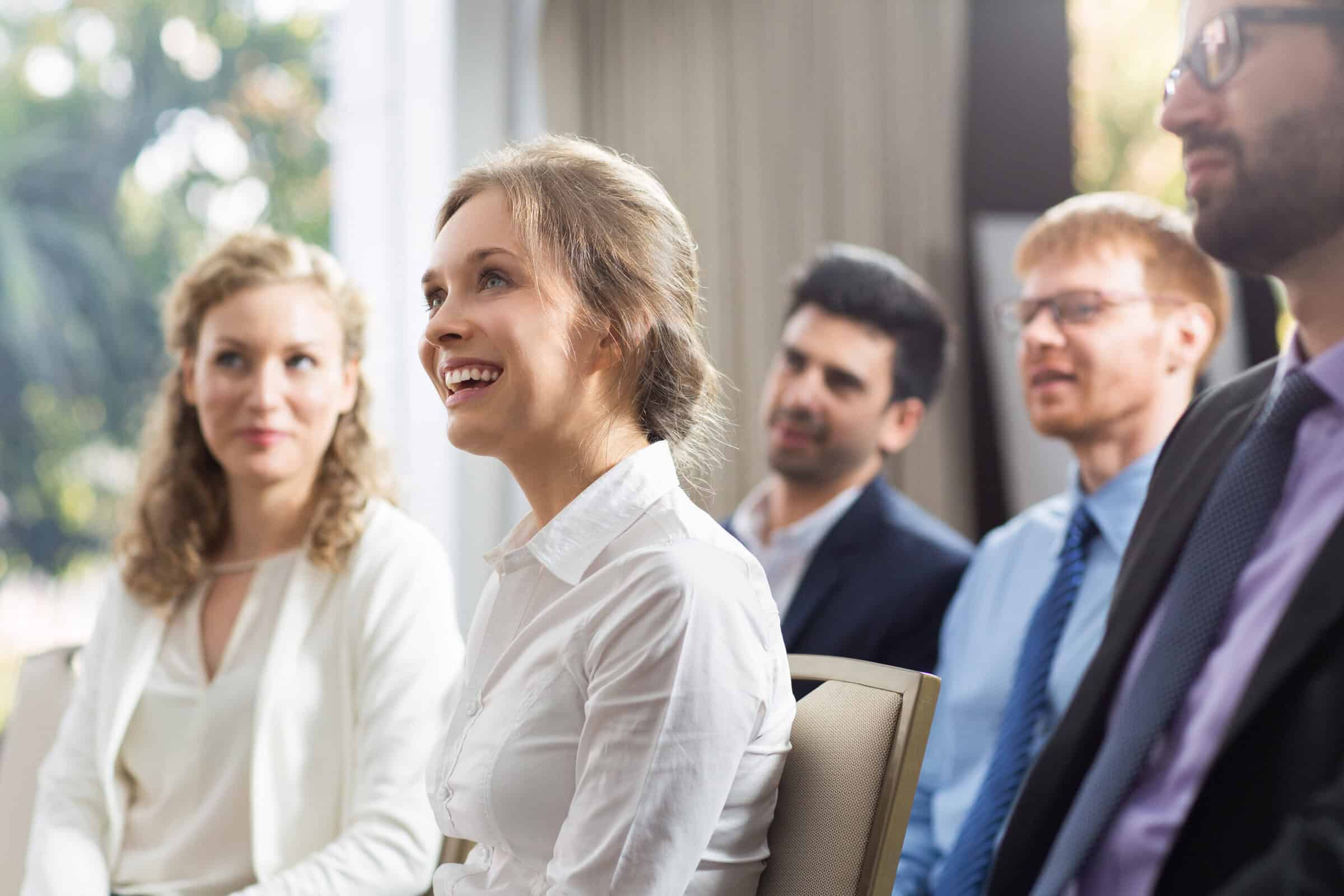 woman-sitting-public-smiling-scaled Training